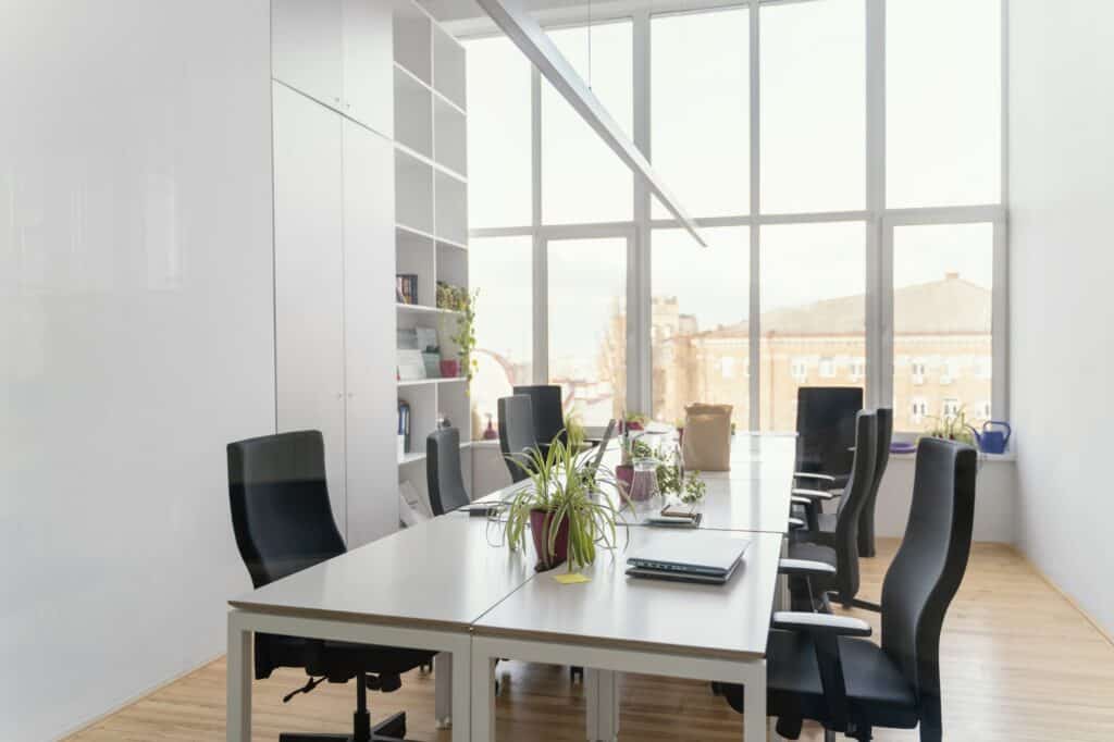 A minimalist office meeting room in the concept of 'How to Set Up a New Office After the Move'.